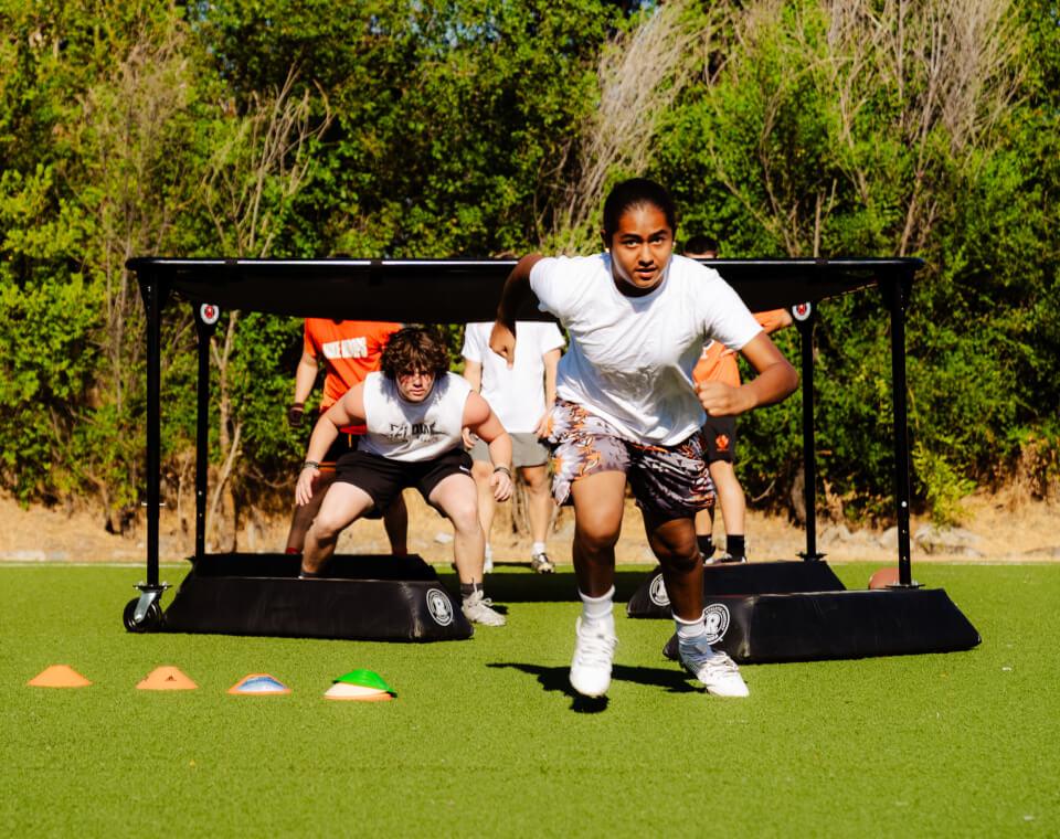 An athlete drives out of a chute during a Pro Vision camp