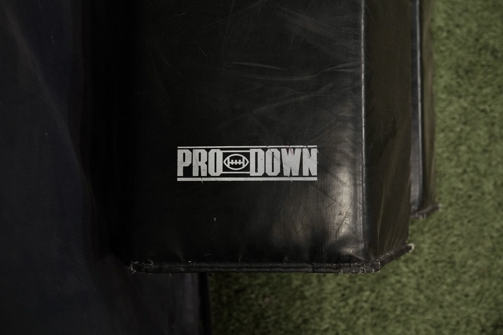 A blocking pad rests on the turf